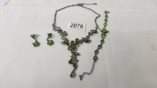 A costume necklace with matching earrings and bracelet.