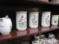 4 Royal Worcester storage jars and a jug with Worcester Herbs decoration