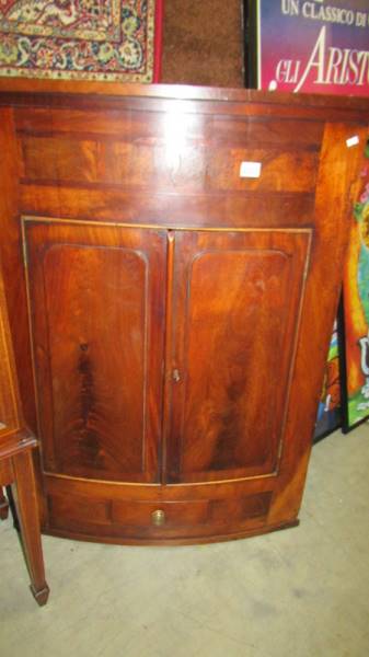 A Victorian mahogany corner cupboard.