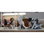 4 dog figurines,