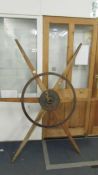 A large cast metal and wood star shaped wheel marked Kirby & Son, Engineers, Walsall.