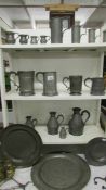 A good collection of period pewter including measures, tankards, plates etc.