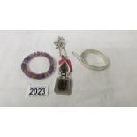 A circa 1980's silver bangle together with an amethyst and quartz bracelet and a heavy quality