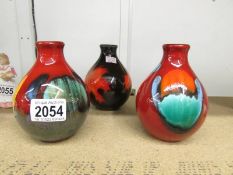 3 Poole pottery vases.