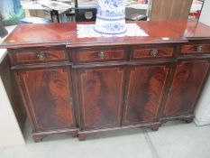 A darkwood stained wall unit with string inlay, 4 door, 4 drawer, no keys, Width 152cm,