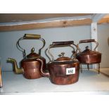 3 vintage copper kettles and a trivet (one has a brass handle)