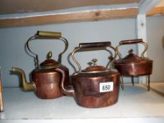 3 vintage copper kettles and a trivet (one has a brass handle)