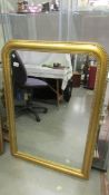 A gilt framed mirror, 108 x 76 cm.