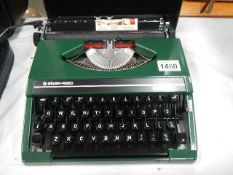 A Silver Reed portable typewriter.