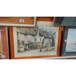 A framed and glazed watercolour village scene.