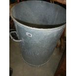 An old metal dust bin, no lid.