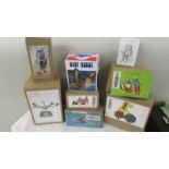 A collection of 8 boxed tin plate toys.