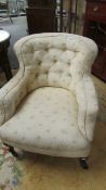 A deep buttoned arm chair.