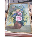 A framed vase of flowers study signed Reaveley, 66 x 47 cm.