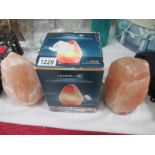 2 illuminating salt crystal lamps,