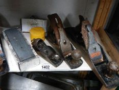 A quantity of woodworking planes etc.