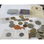 A mixed lot of coins including some silver.