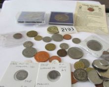 A mixed lot of coins including some silver.