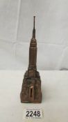 A 1950's copper plated spelter Empire State Building money box. (Missing stopper).