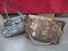 A Butler and Wilson leopard handbag and a Butler and Wilson black and white animal print handbag