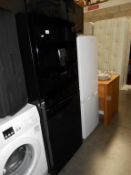 A Daewoo black fridge freezer with water dispenser