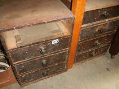 A 2 x 4 drawer chests (one drawer missing).