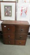 A 6 drawer mahogany chest.