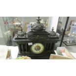 A 19th century black Palladian style mantle clock (chimes a/f).