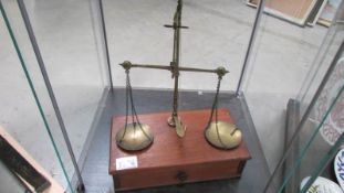 A set of Victorian/Edwardian brass postal scales with weights.