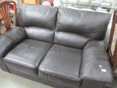 A dark brown 2 seat leather sofa,