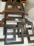 A quantity of old cast iron printing iron frames.
