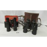 A pair of leather cased binoculars and a boxed pair of Commander MkII with compass binoculars.