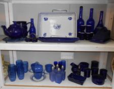 2 shelves of blue (and white) kitchenalia including cheese dish, teapot, condiment bottles,