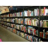 A large quantity of a diverse selection of books on 36 shelves - Collect only
