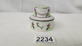 A Lorna Bailey pottery wedding cake, signed to base.