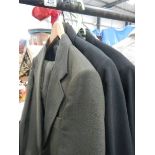 A quantity of blazers and jackets including military, raincoats etc.