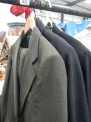 A quantity of blazers and jackets including military, raincoats etc.