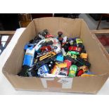 A box of mixed playworn diecast and plastic vehicles