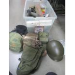 A collection of militaria including airsoft, hats etc.