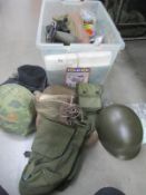 A collection of militaria including airsoft, hats etc.