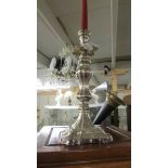 A 19th century ornate silver plate candlestick.