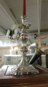 A 19th century ornate silver plate candlestick.