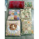 A quantity of embroidered cushions.