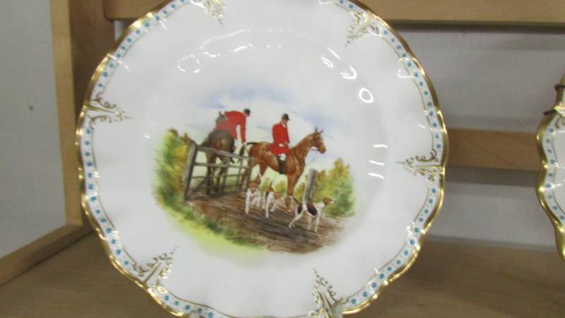 A pair of Royal Crown derby plates hand painted with hunting scenes. - Image 3 of 4