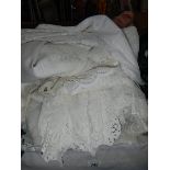 A large quantity of white linen, net curtains etc.