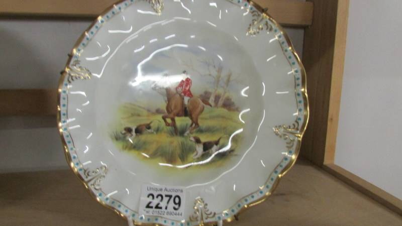 A pair of Royal Crown derby plates hand painted with hunting scenes. - Image 2 of 4