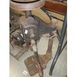 An old cast metal hand bench drill.