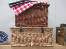 2 wicker picnic baskets and 2 small picnic table clothes