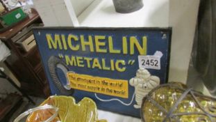 A cast iron Michelin sign. ****Condition report**** The size is 29.