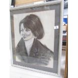 A 20th century charcoal and chalk portrait of a young French woman,